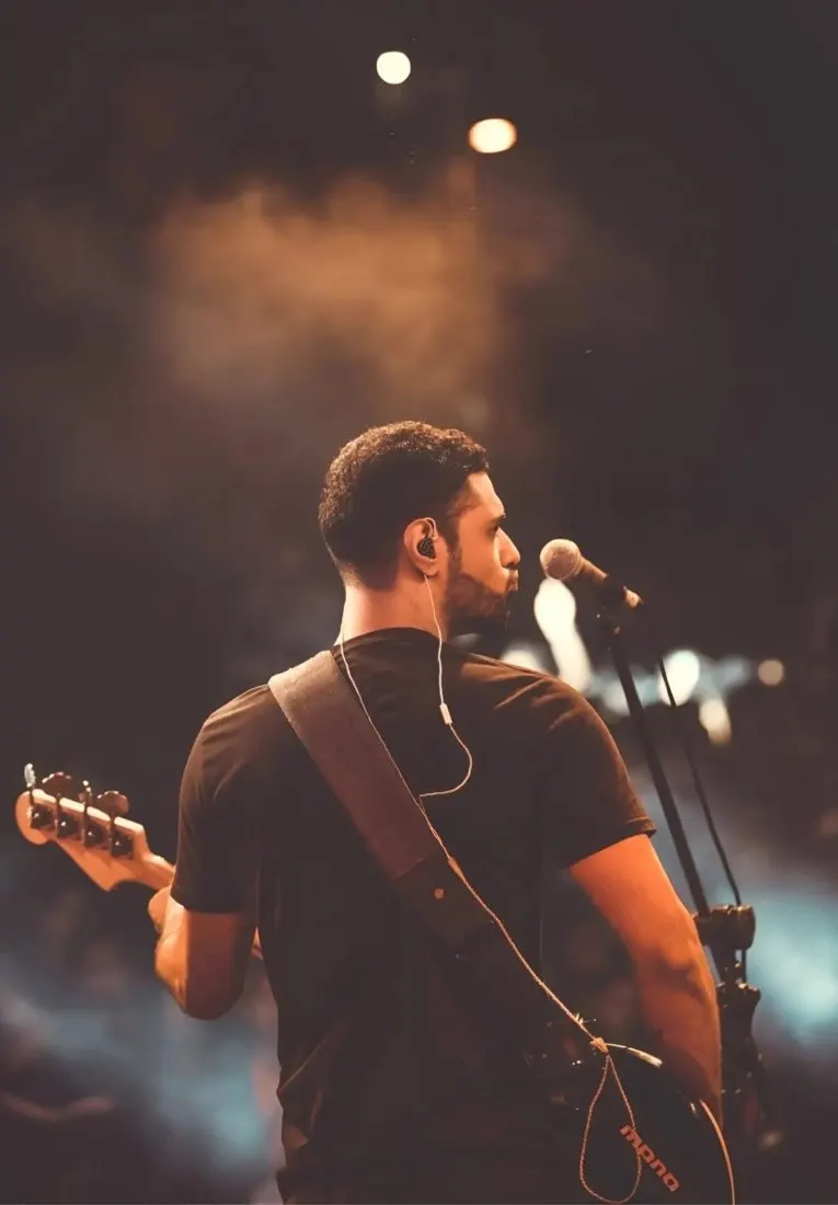 Musician performing live with a guitar