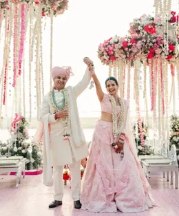 Couple celebrating with raised hands